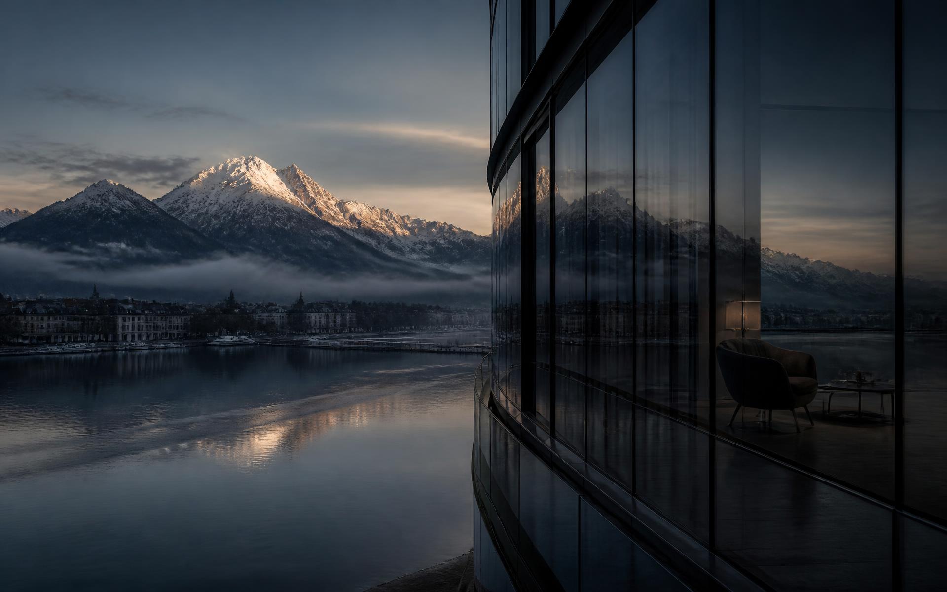Alpes suíços ao amanhecer vistos da fachada de vidro de um banco privado em Zurique